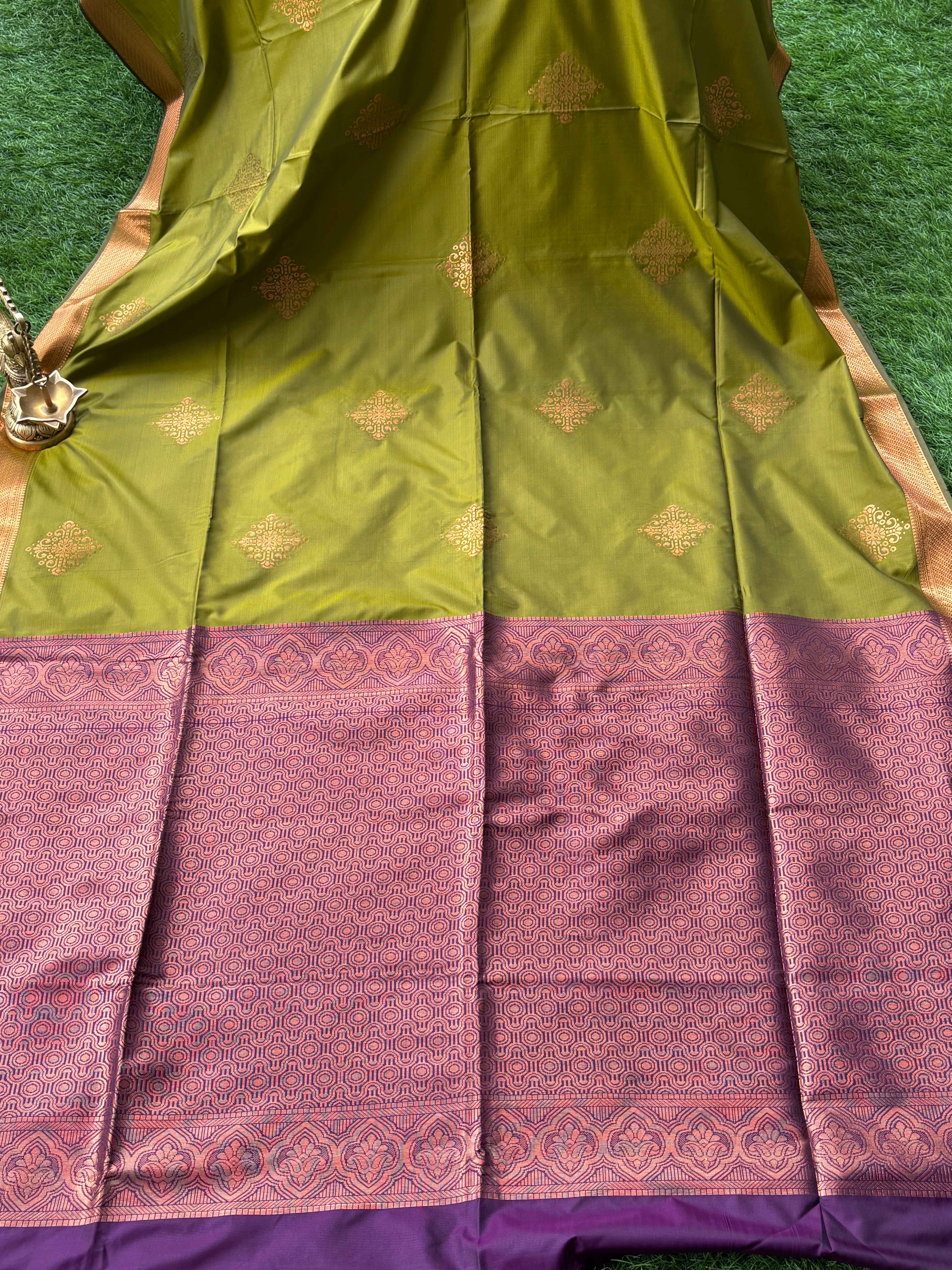 Royal Green Art Silk Kanjeevaram Saree with All-Over Zari Buttas & Purple Pallu