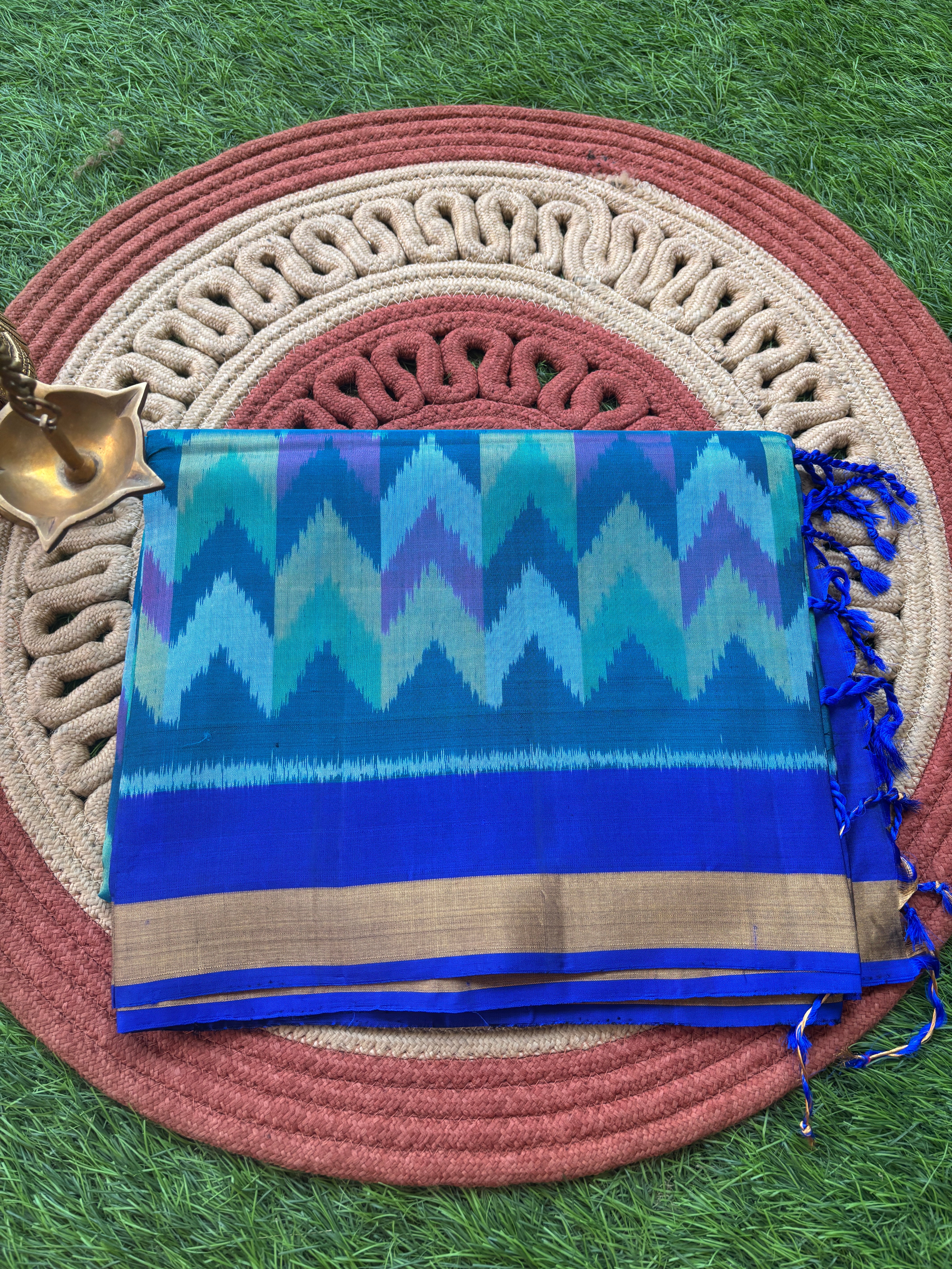 Pure Silk Ikkat Saree in Peacock Green & Peacock Blue in Multicolor Ikkat design and pallu and small golden Zari Border ikkat pallu with tassals