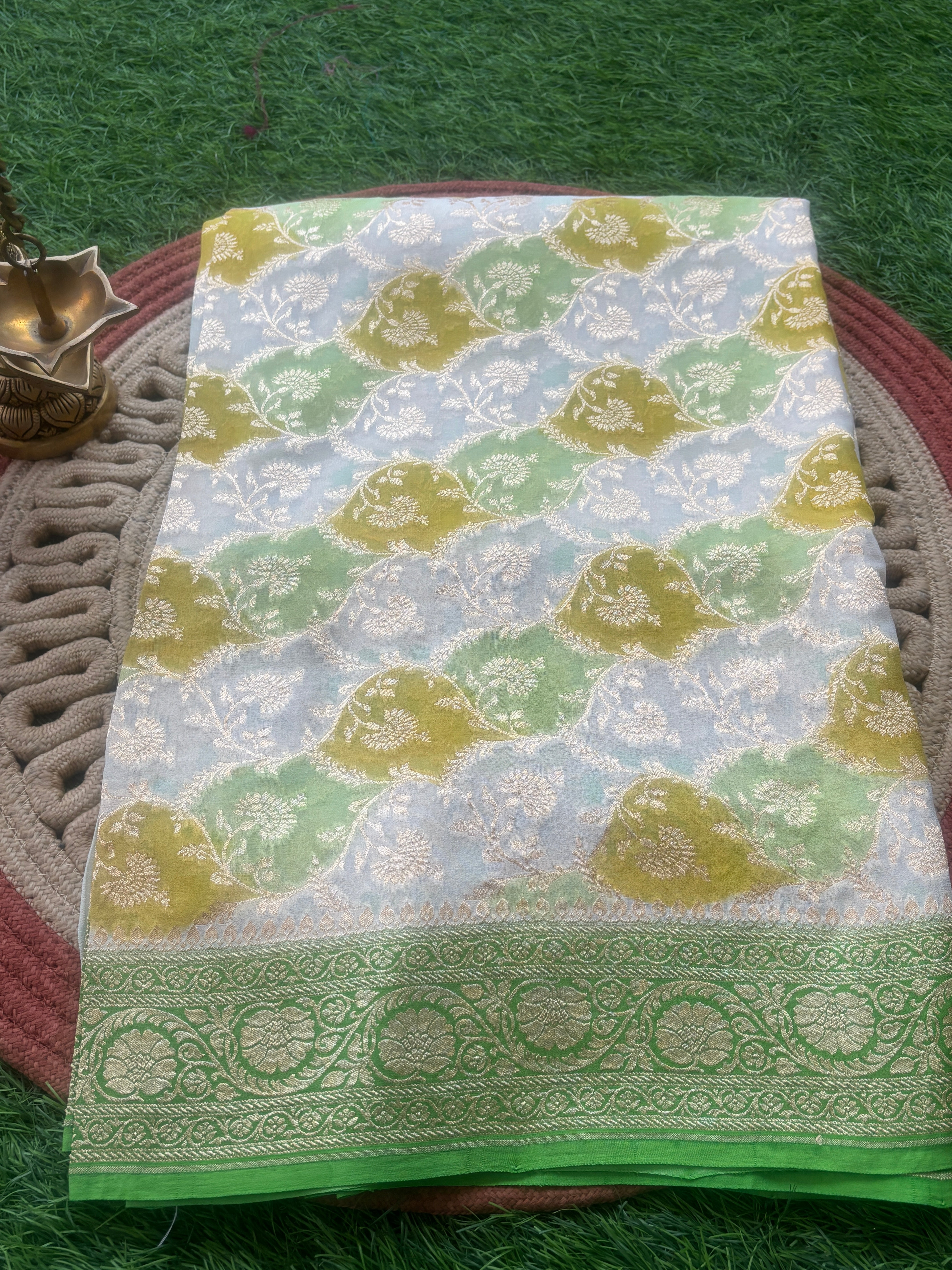 Pastel off white lemon yellow pista Khaddi Georgette Banarasi saree with golden zari jaal by Chandrika Lifestyles
