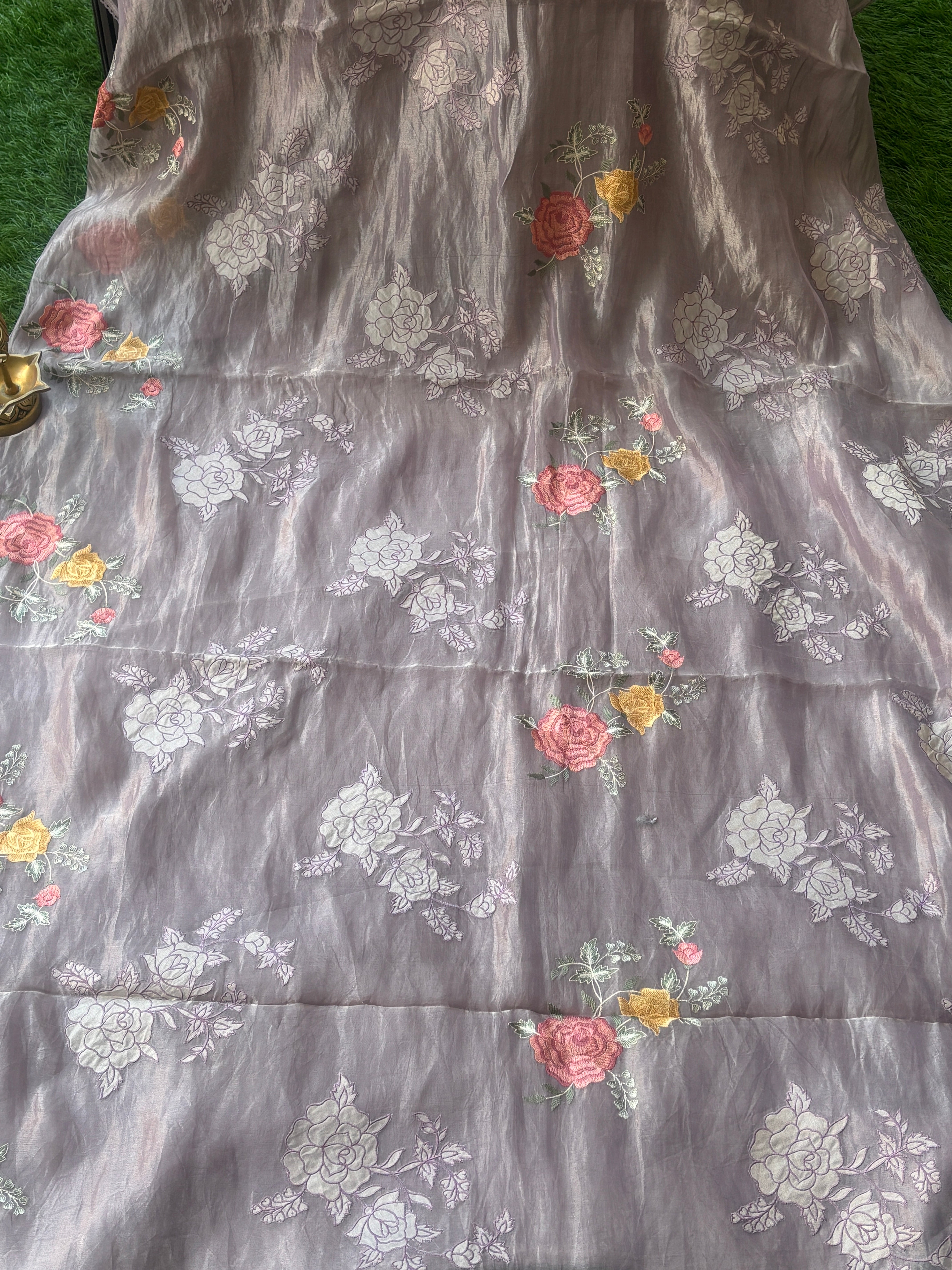 Floral embroidery pallu detail of pastel purple tissue Kora organza saree