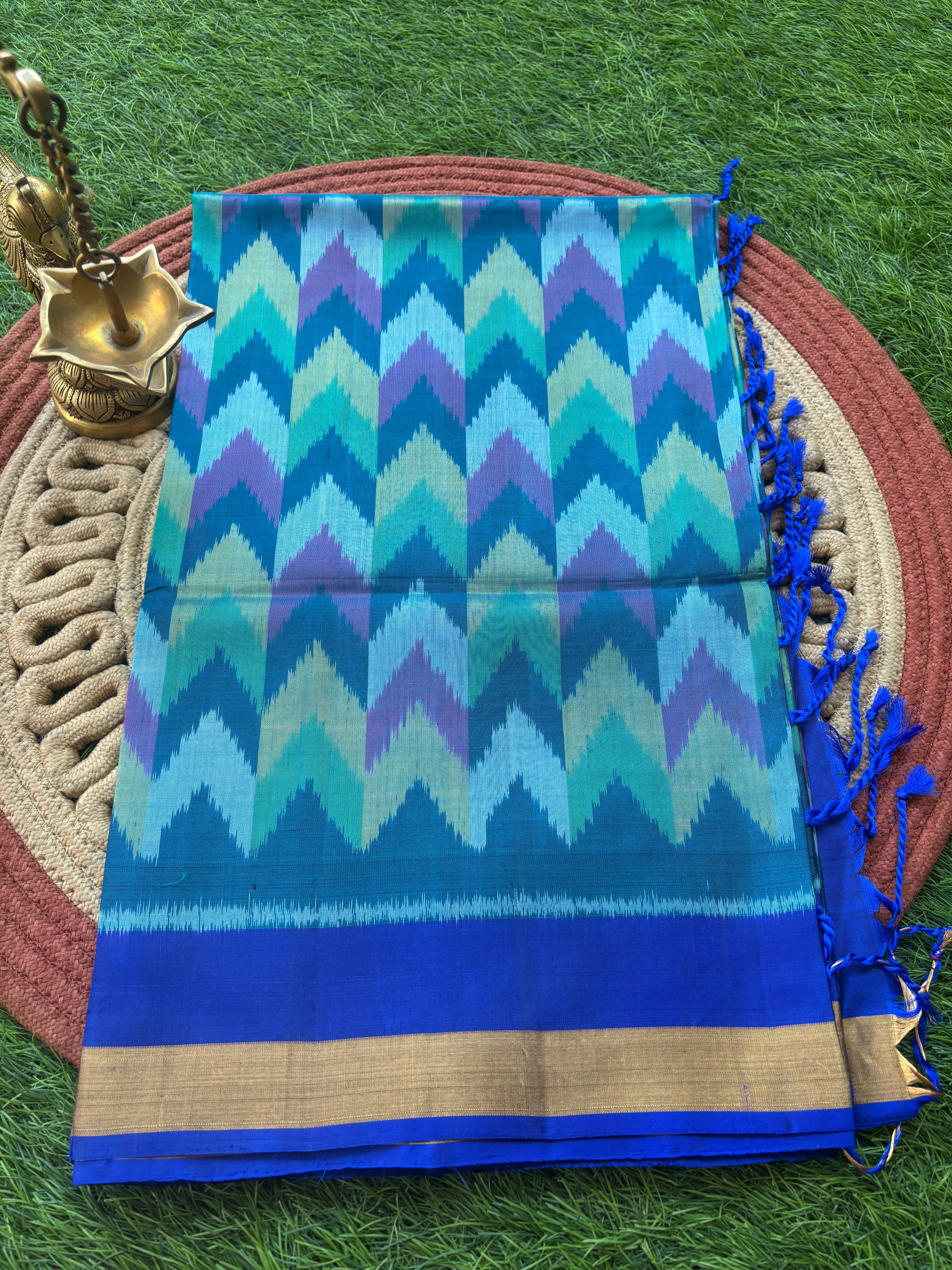 Pure Silk Ikkat Saree in Peacock Green & Peacock Blue in Multicolor Ikkat design and pallu and small golden Zari Border ikkat pallu with tassals