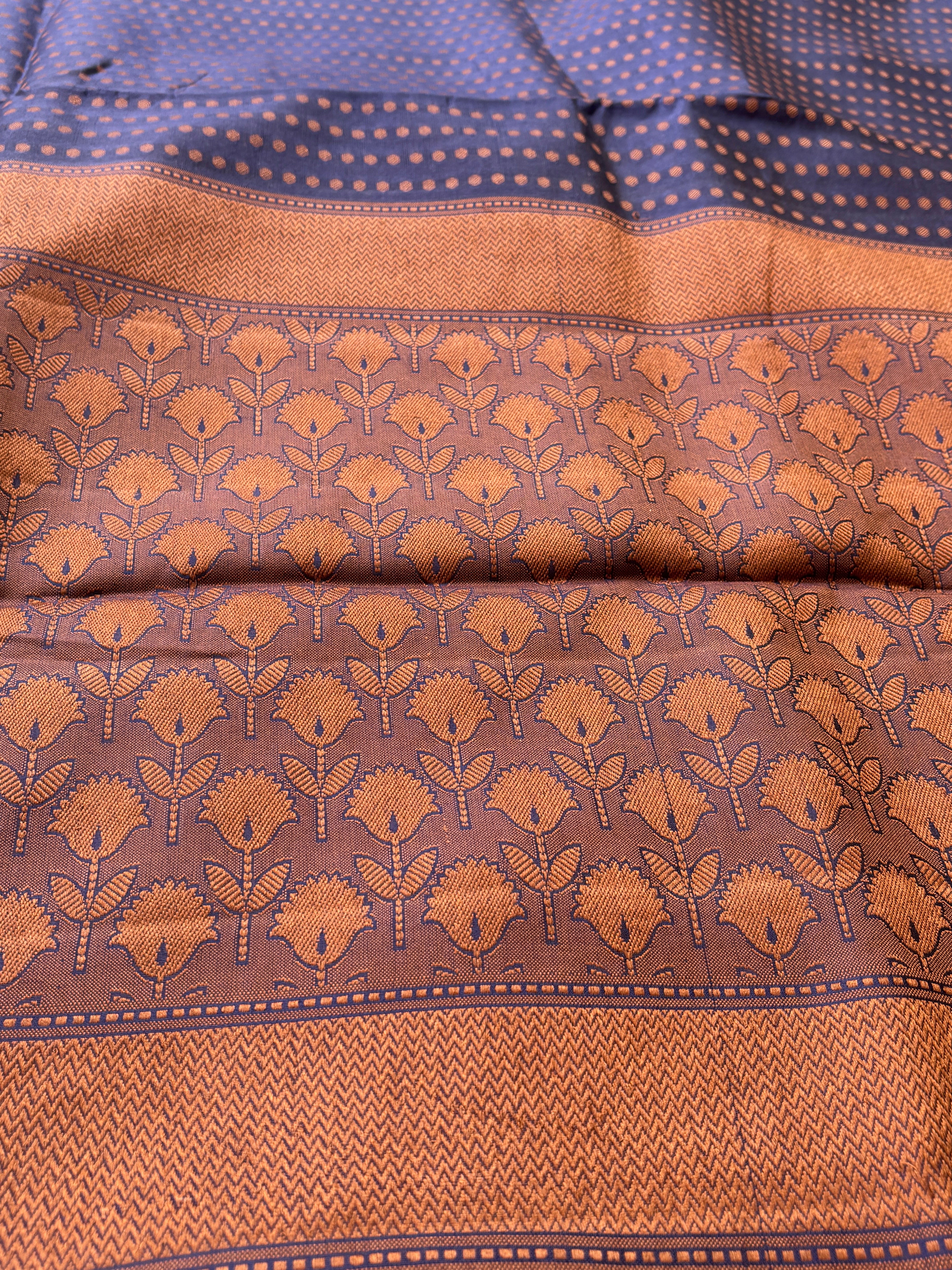 Close-up of detailed resham thread weaving on navy blue dupion silk