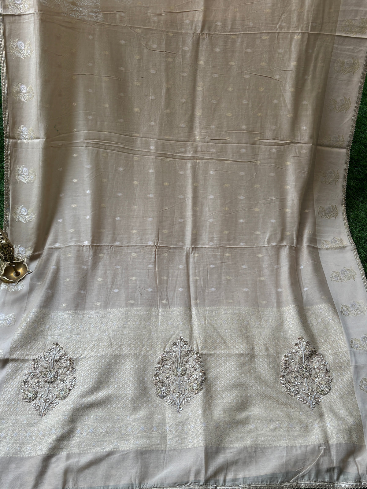 Banarasi weaving offwhite sari with embroidery Zardozi Buta on Pallu all over weaving on the sari and with ready-made blouse