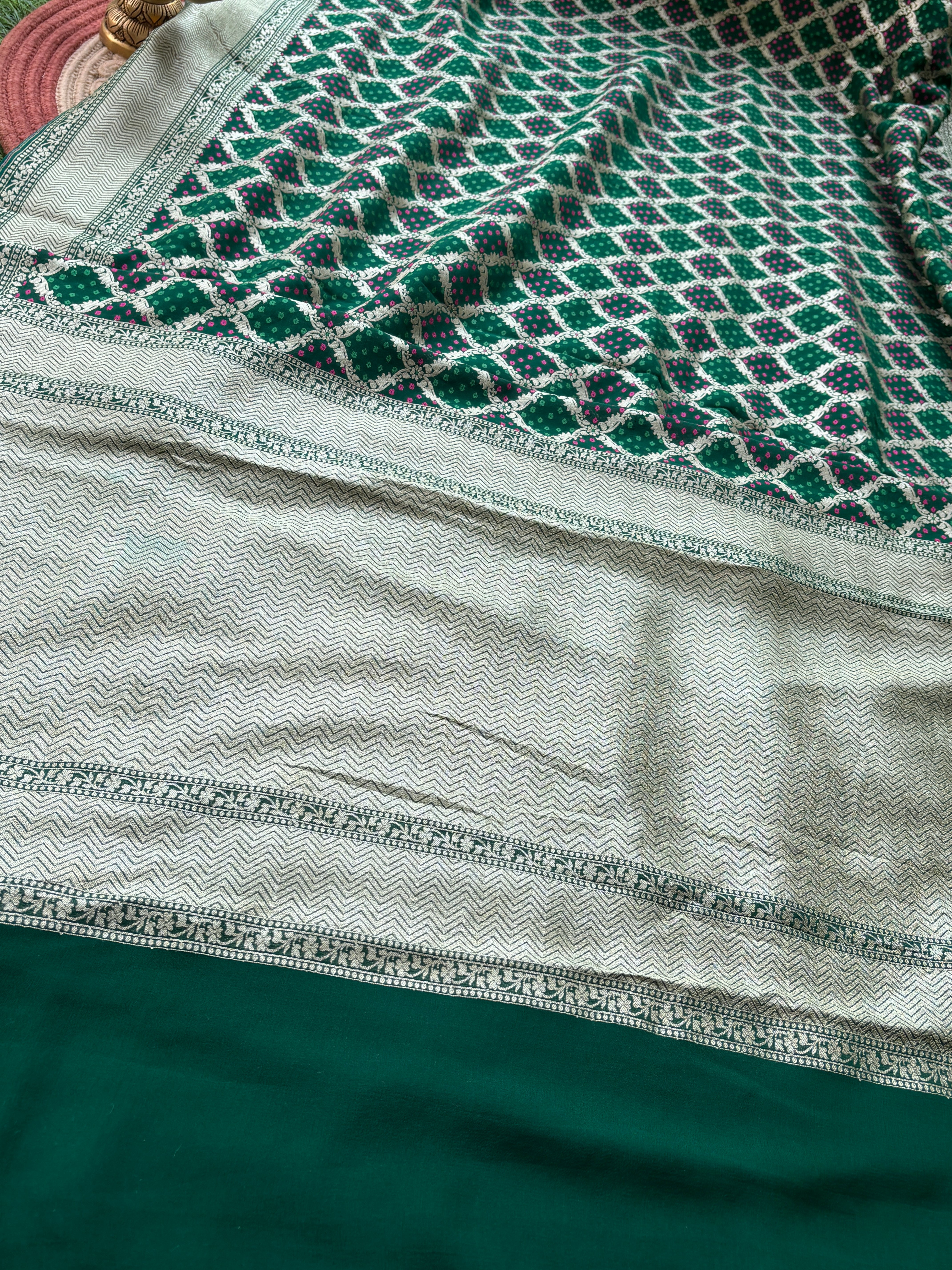 Close-up of batik woven jaal pattern on green khaddi georgette Banarasi saree