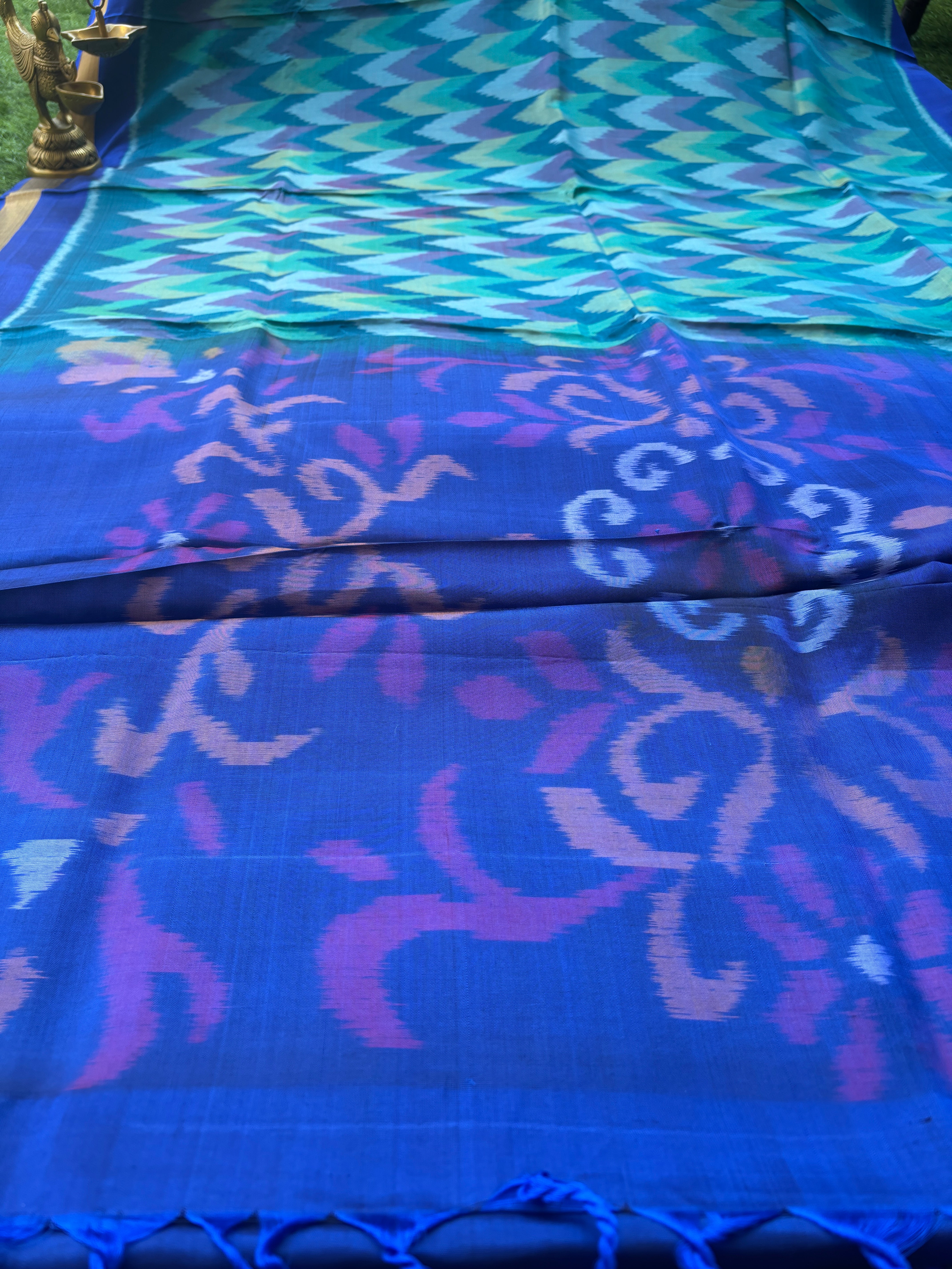 Pure Silk Ikkat Saree in Peacock Green & Peacock Blue in Multicolor Ikkat design and pallu and small golden Zari Border ikkat pallu with tassals