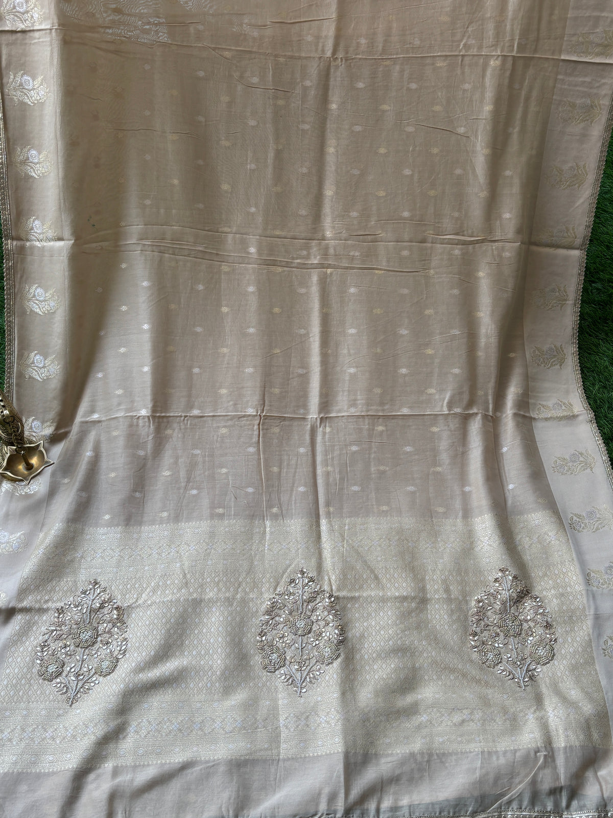 Banarasi weaving offwhite sari with embroidery Zardozi Buta on Pallu all over weaving on the sari and with ready-made blouse