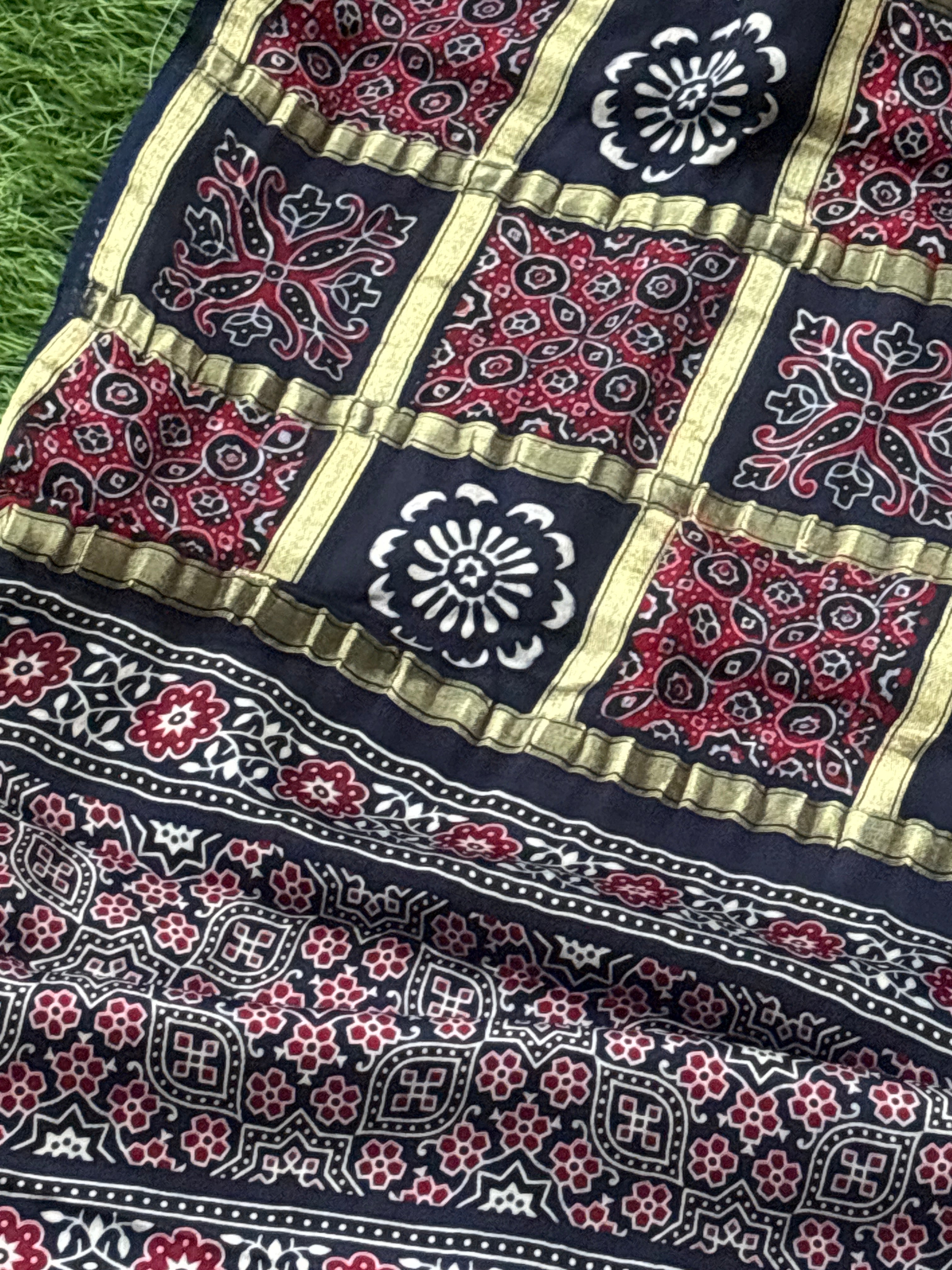 Close-up of golden gharchola checks on royal blue pure modal silk saree