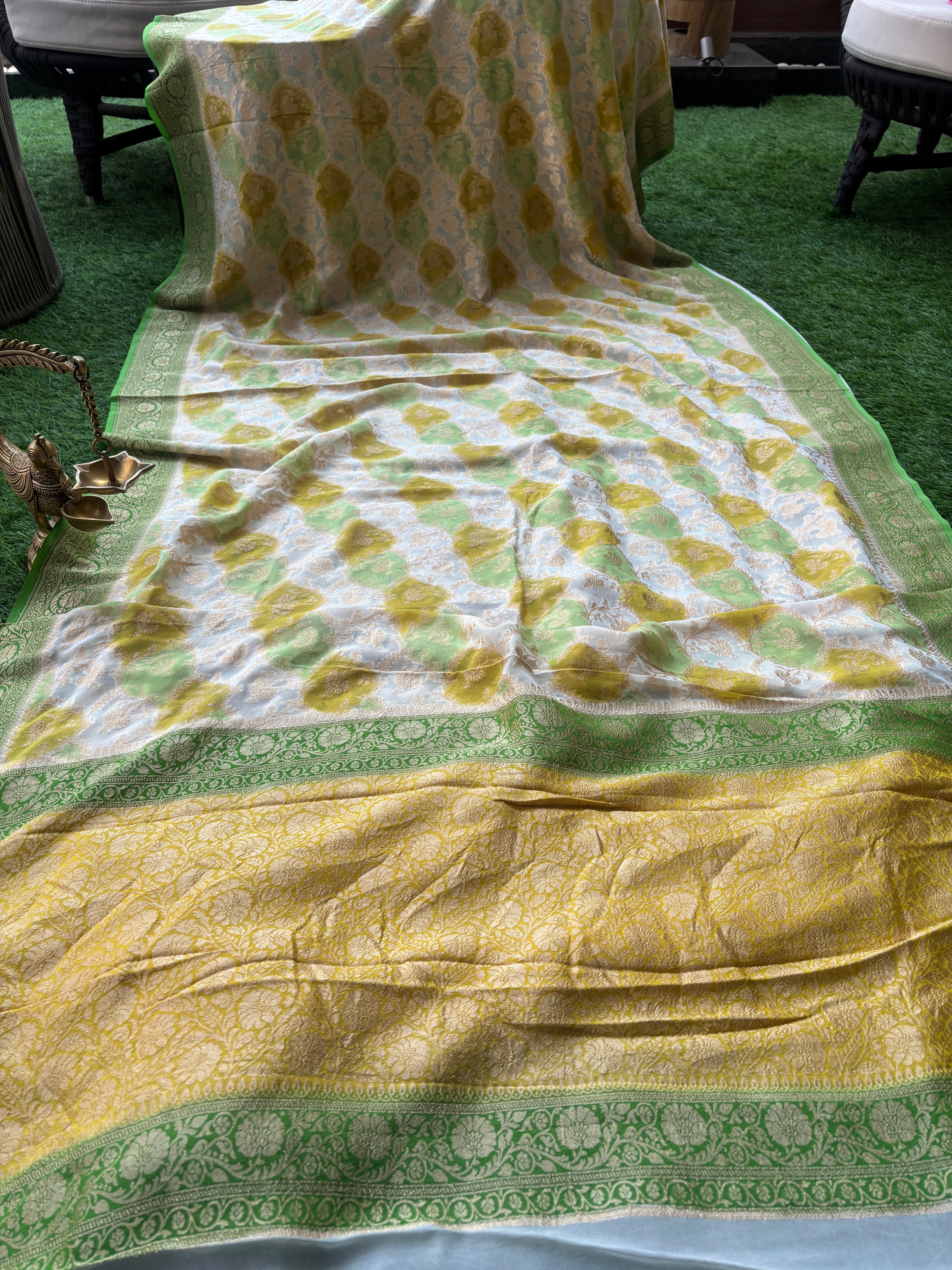 Detailed view of richly woven golden zari jaal pallu in pastel Banarasi saree