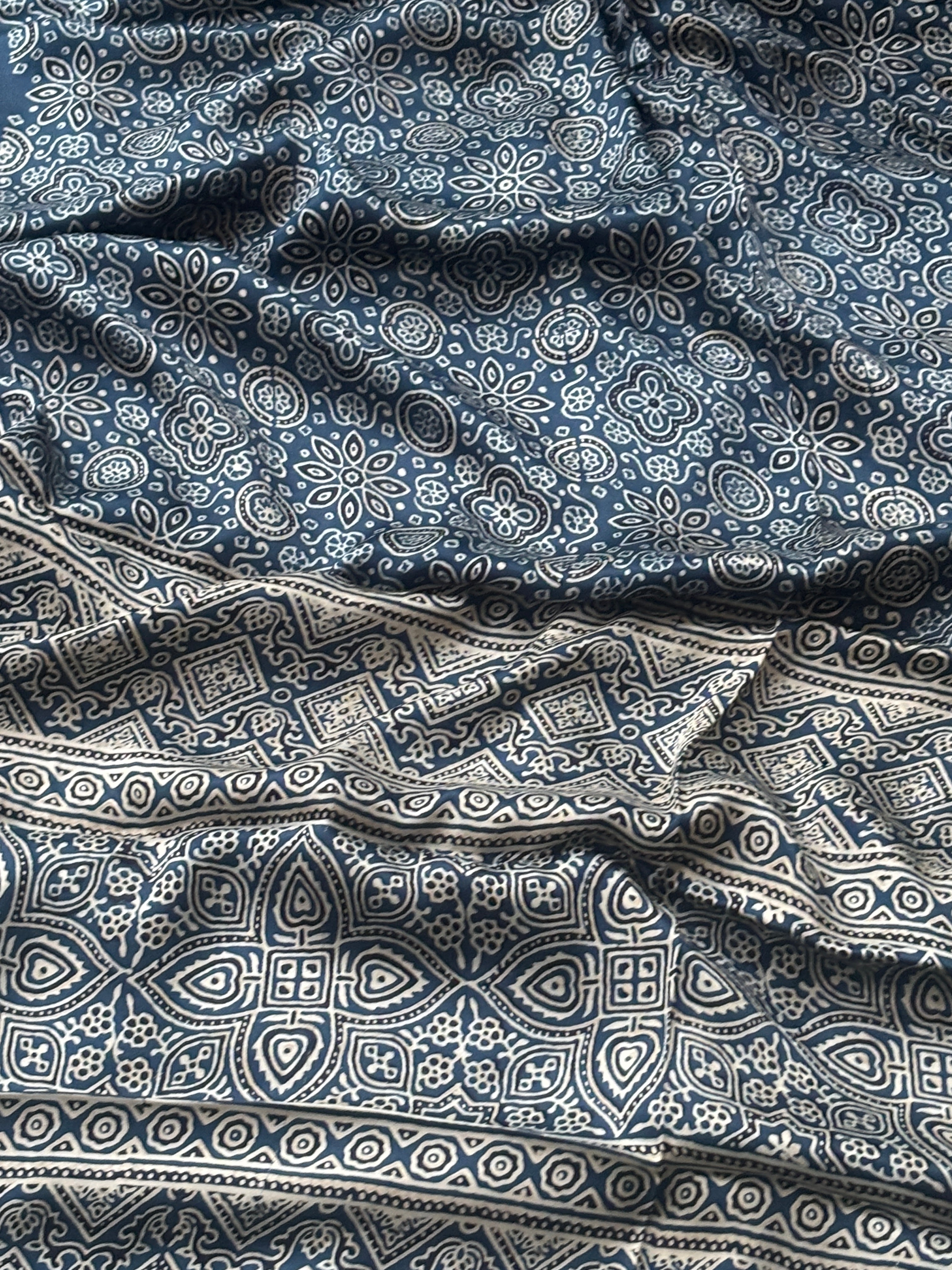 Matching navy blue modal silk blouse piece of the saree
