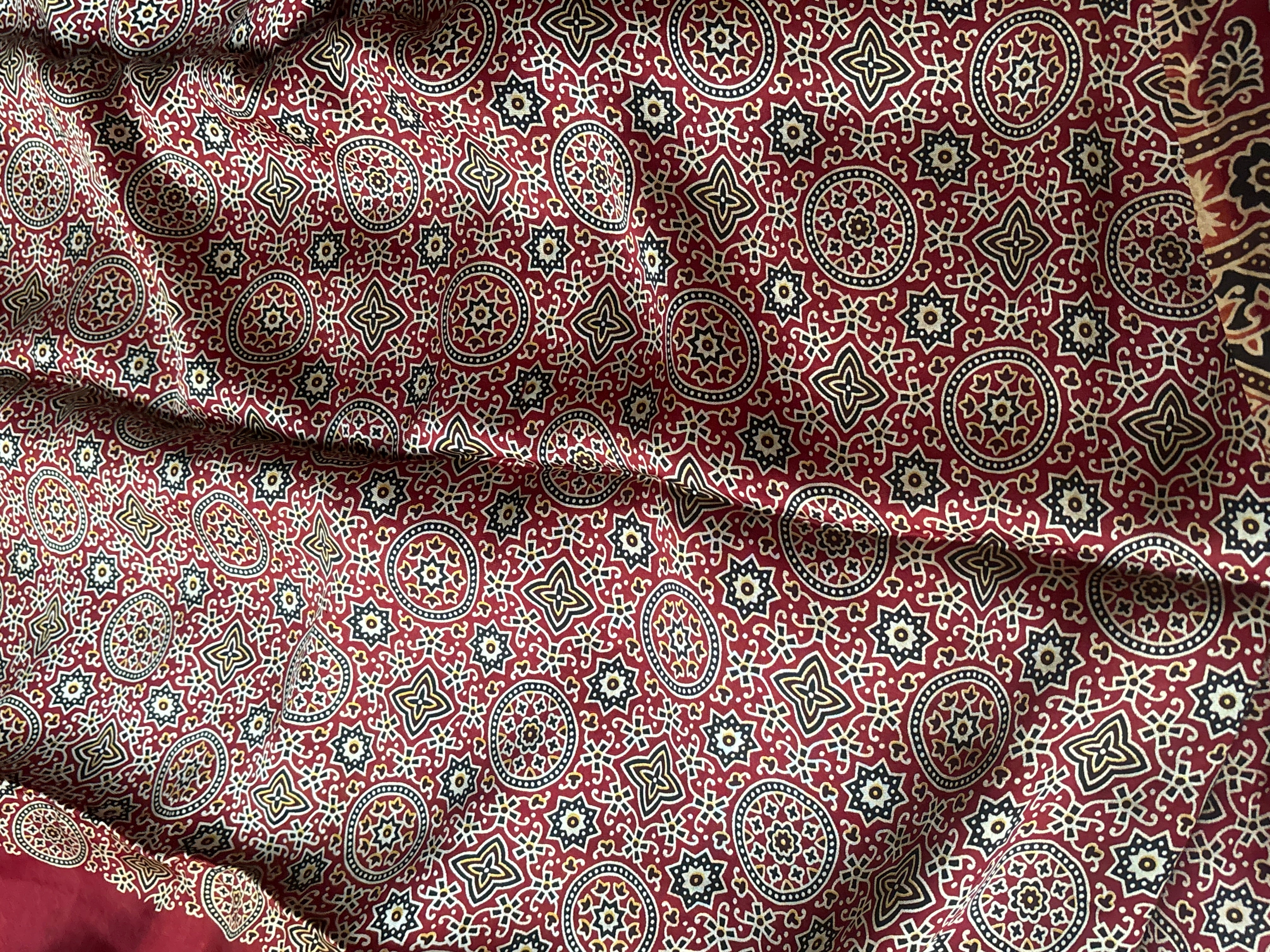 Matching red modal silk blouse piece for the Gharchola Saree