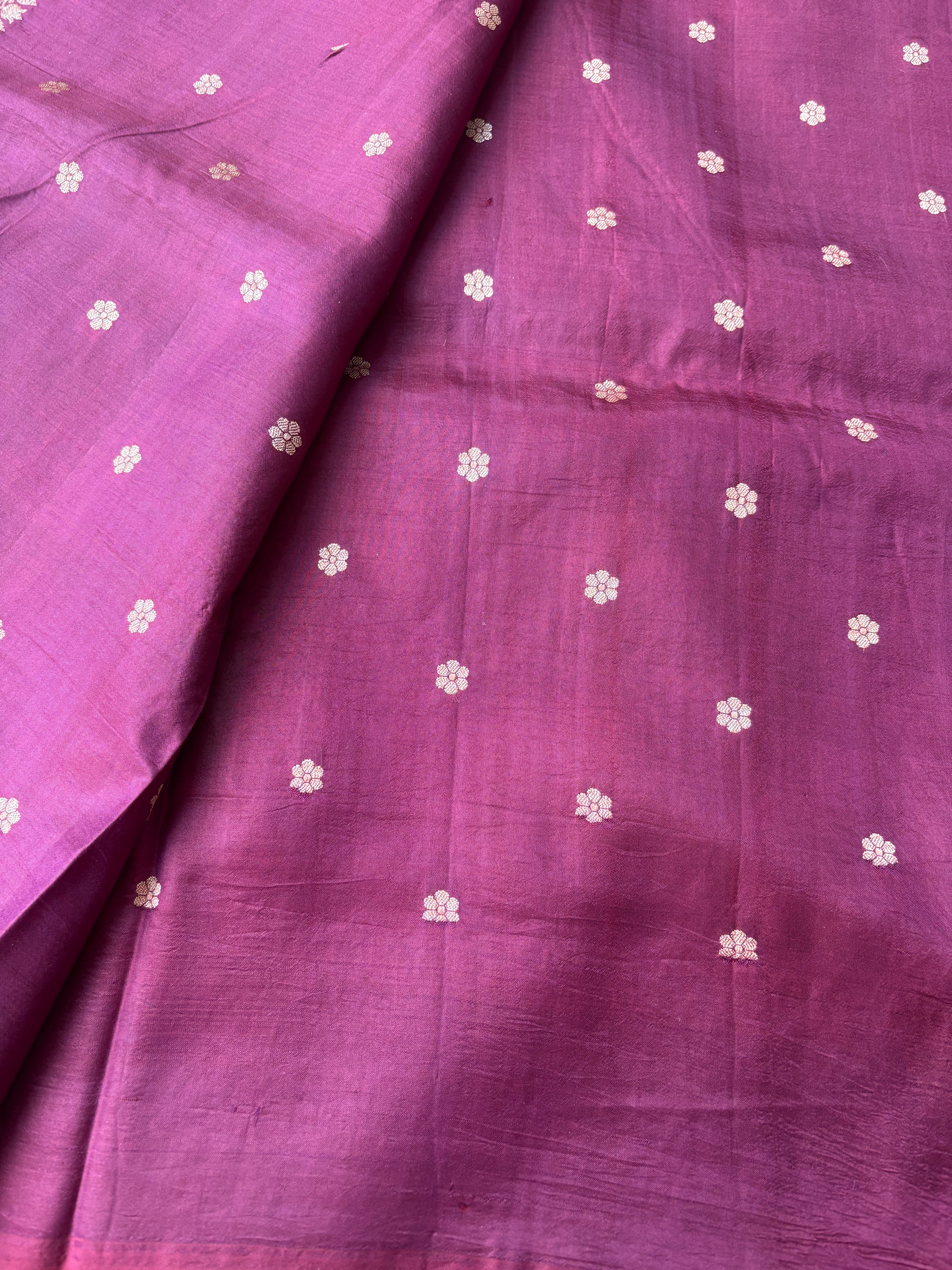 Wine color contrast blouse with zari border paired with red Banarasi saree