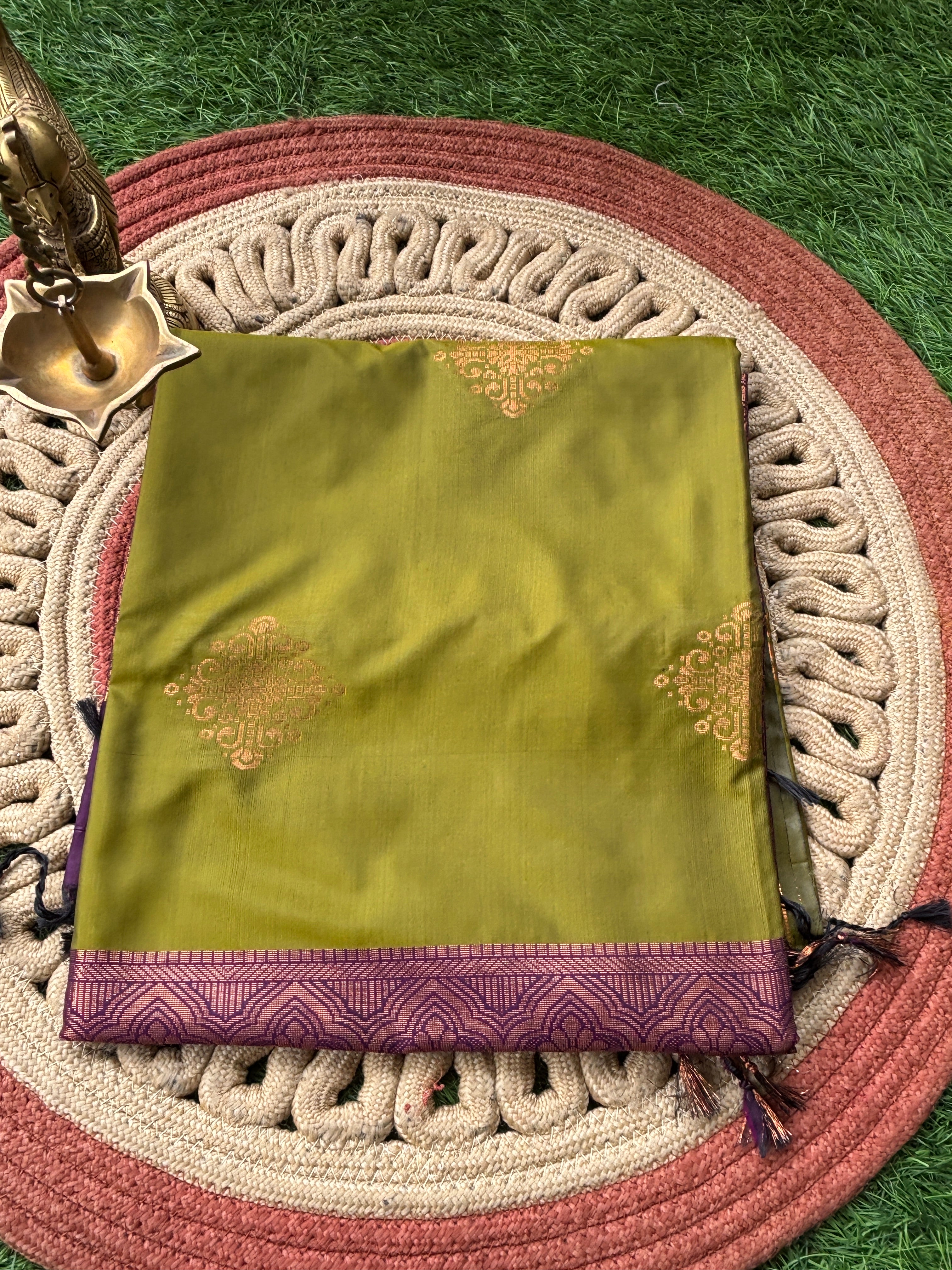 Royal Green Art Silk Kanjeevaram Saree with All-Over Zari Buttas & Purple Pallu