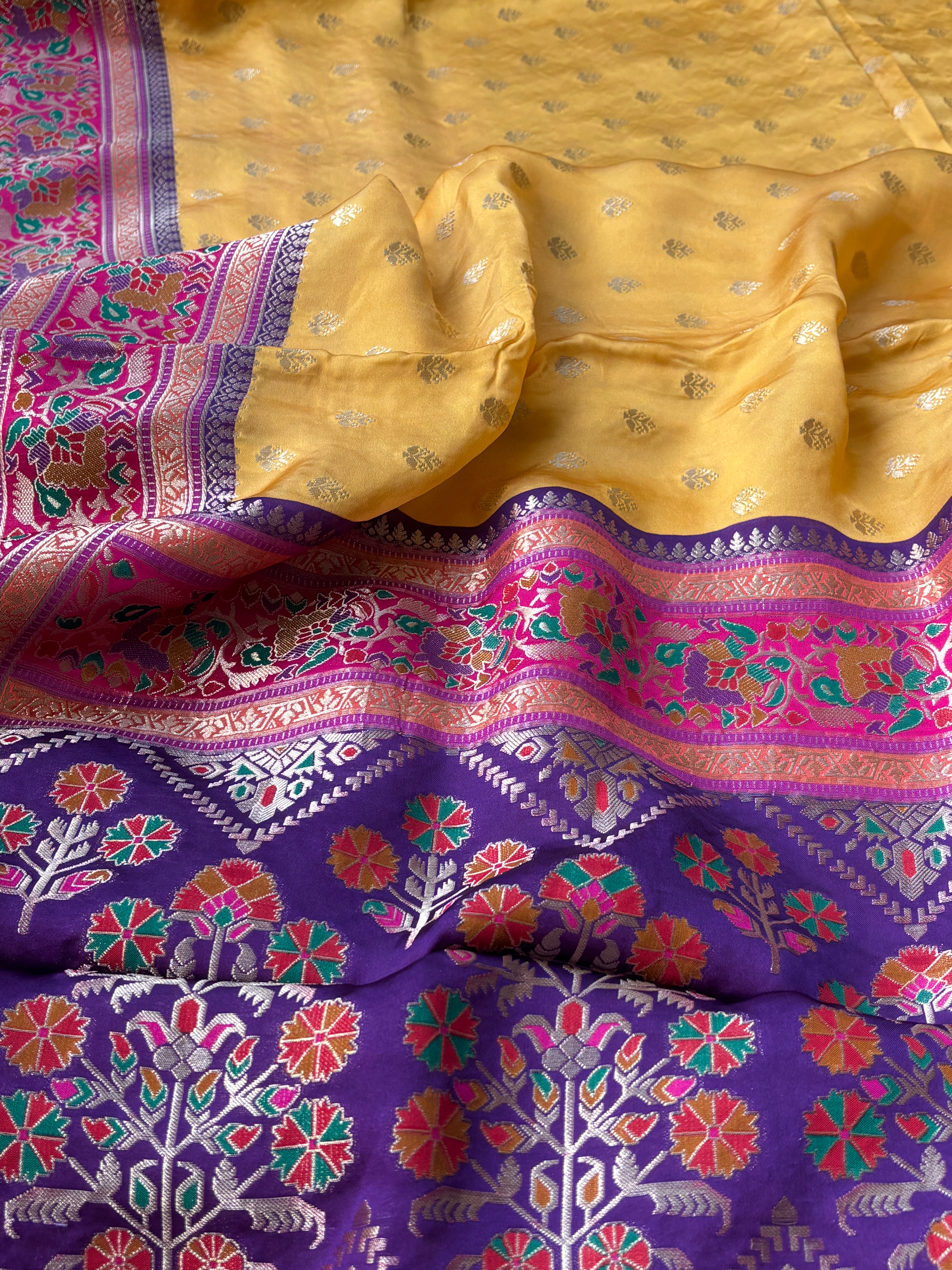 Smooth glossy texture of pure Mashru silk with traditional Banarasi weave pattern