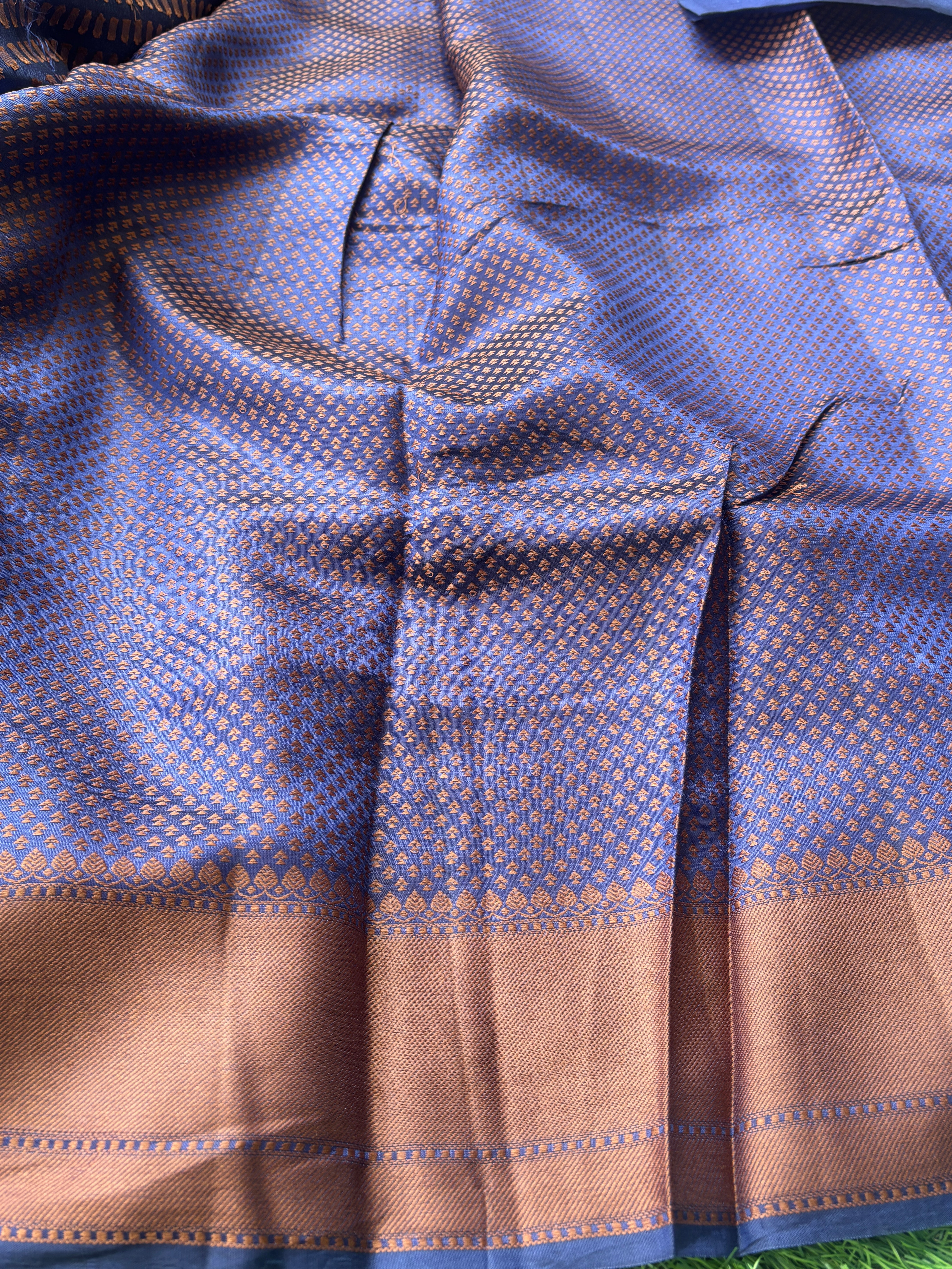 Self navy blue blouse with woven border paired with Banarasi dupion silk saree