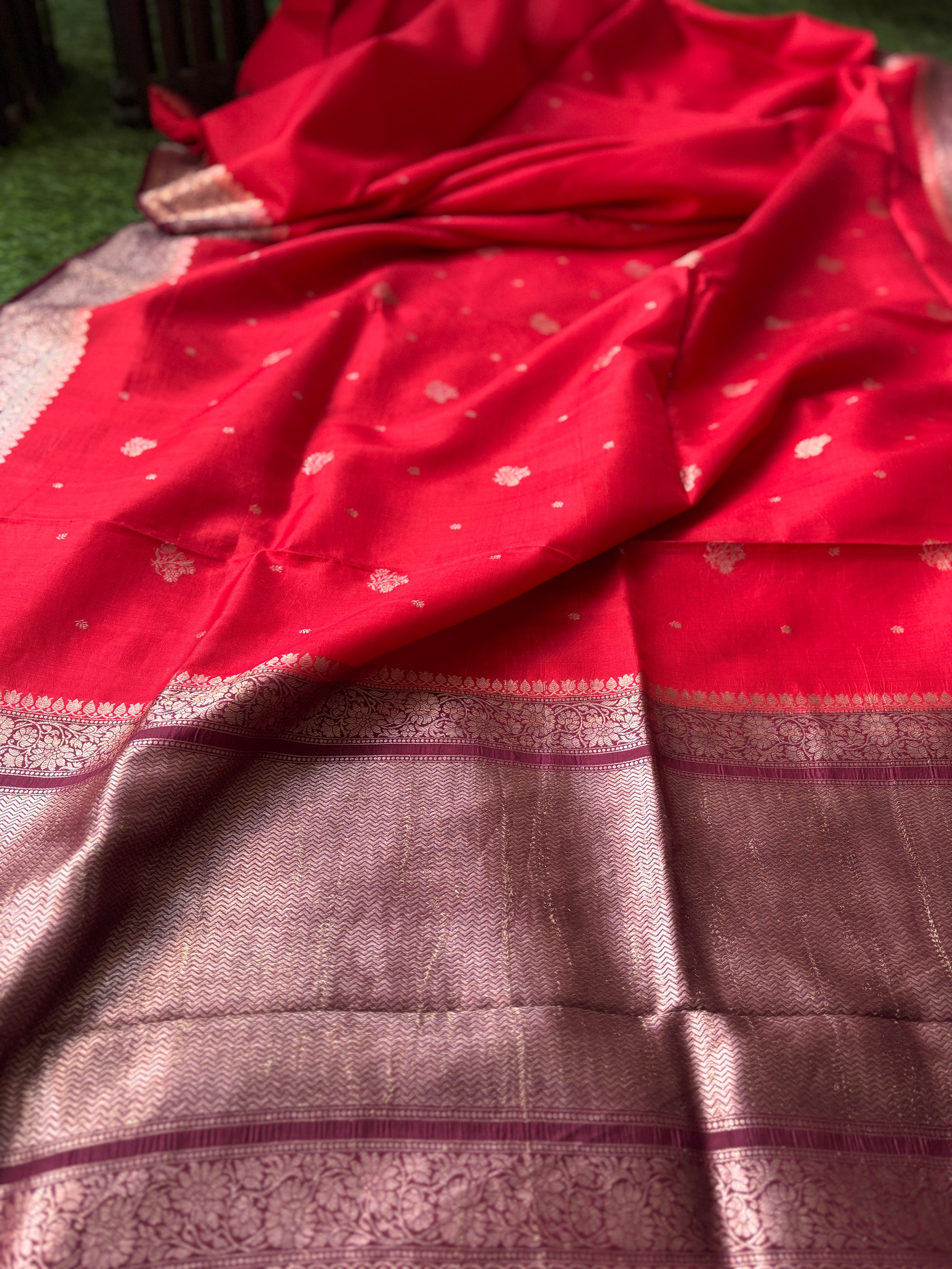 Luxurious smooth texture of pure silk fabric with traditional Banarasi weave