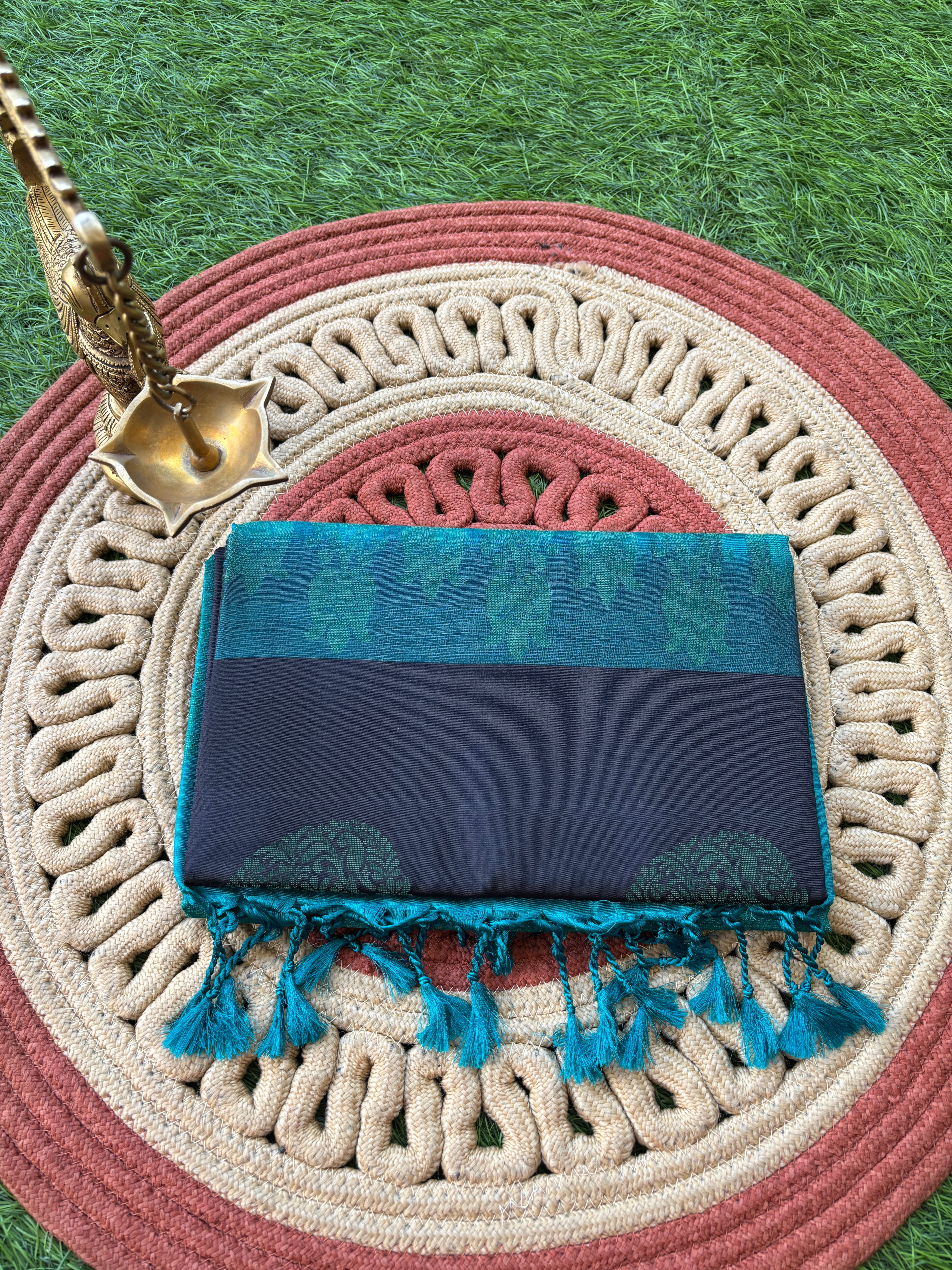 Borderless Black Kanjeevaram Silk Saree with All Over Zari Buttas and Sea Green Contrast Pallu
