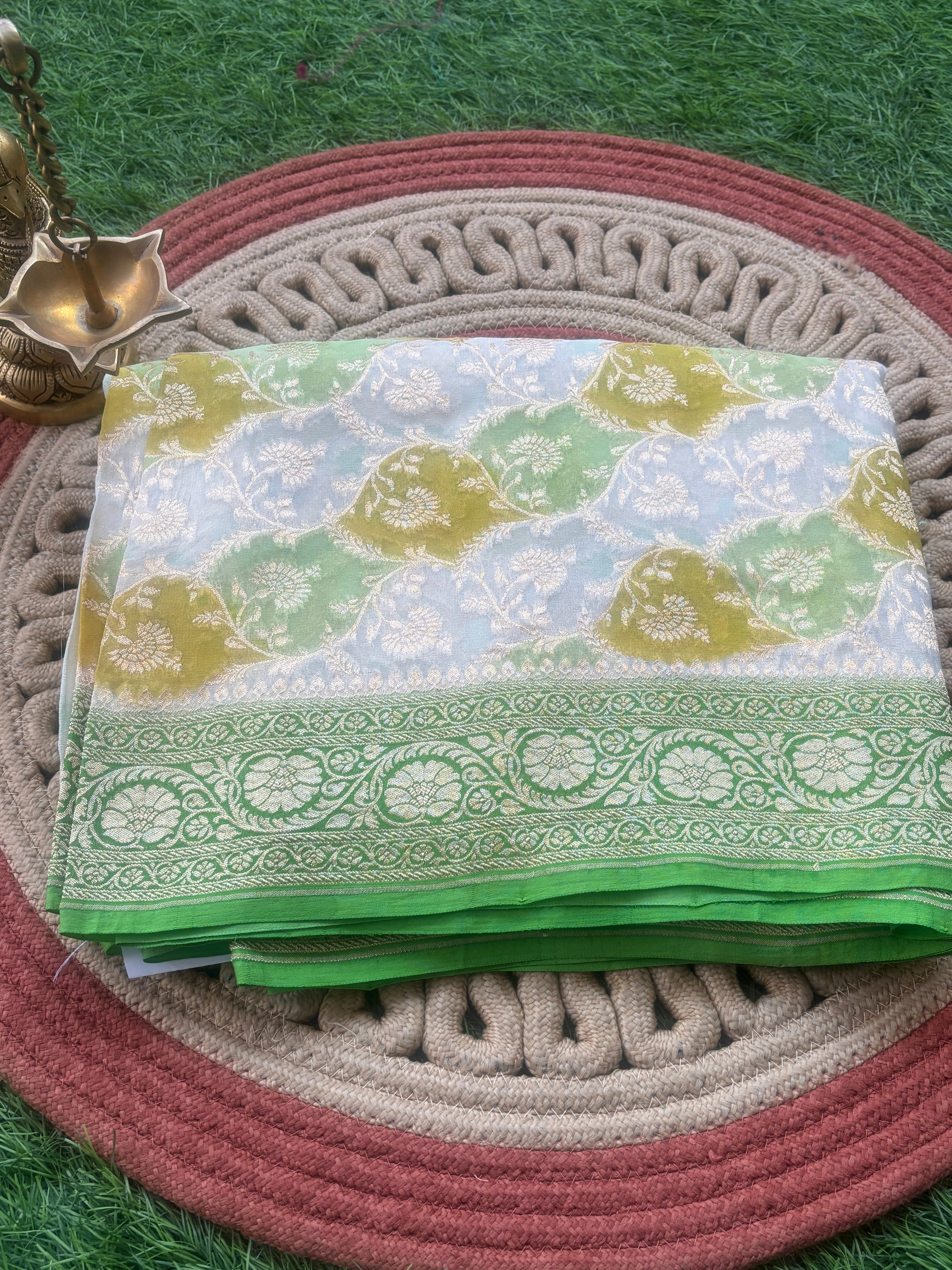 Pastel off white lemon yellow pista Khaddi Georgette Banarasi saree with golden zari jaal by Chandrika Lifestyles