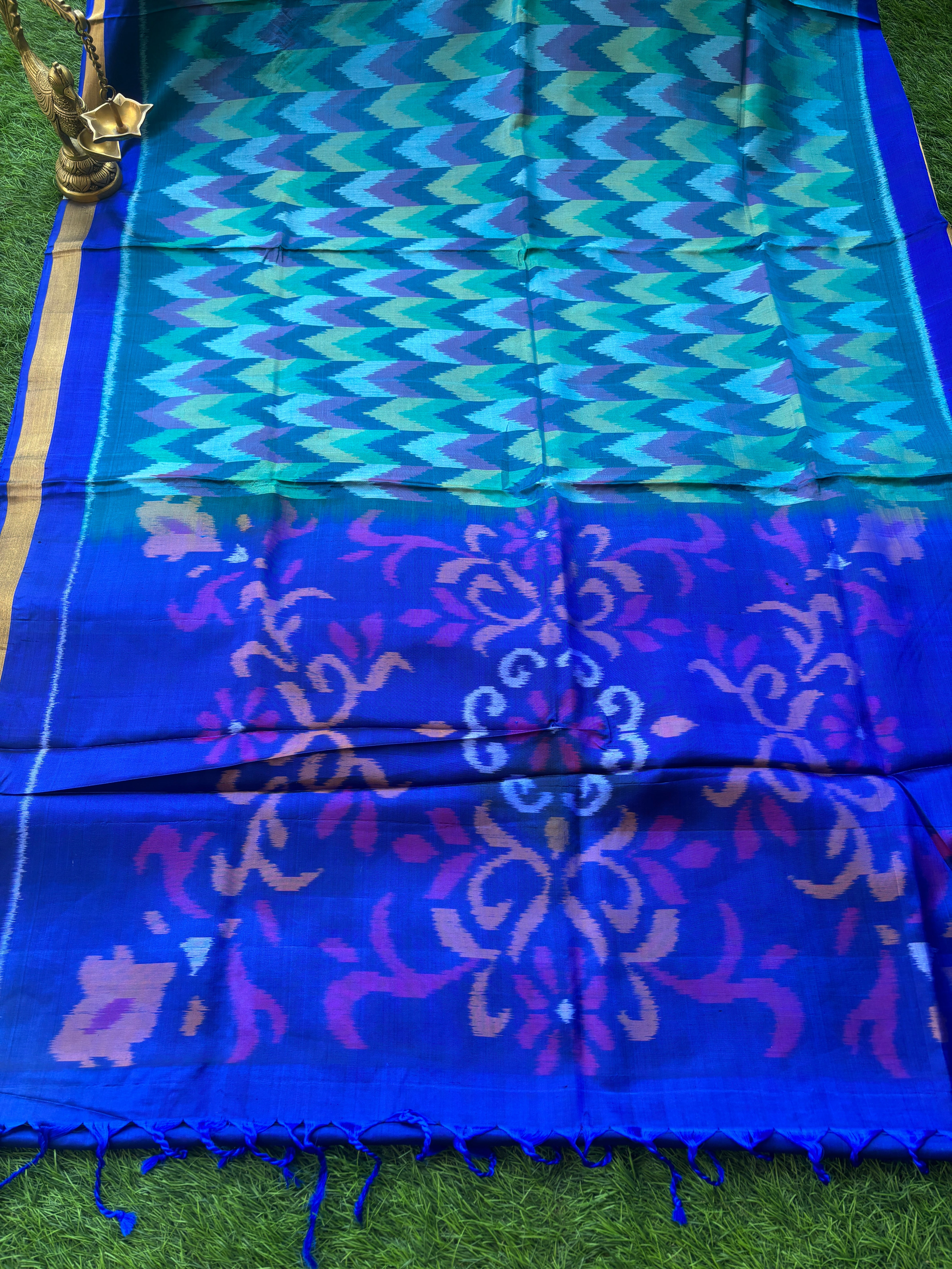 Pure Silk Ikkat Saree in Peacock Green & Peacock Blue in Multicolor Ikkat design and pallu and small golden Zari Border ikkat pallu with tassals