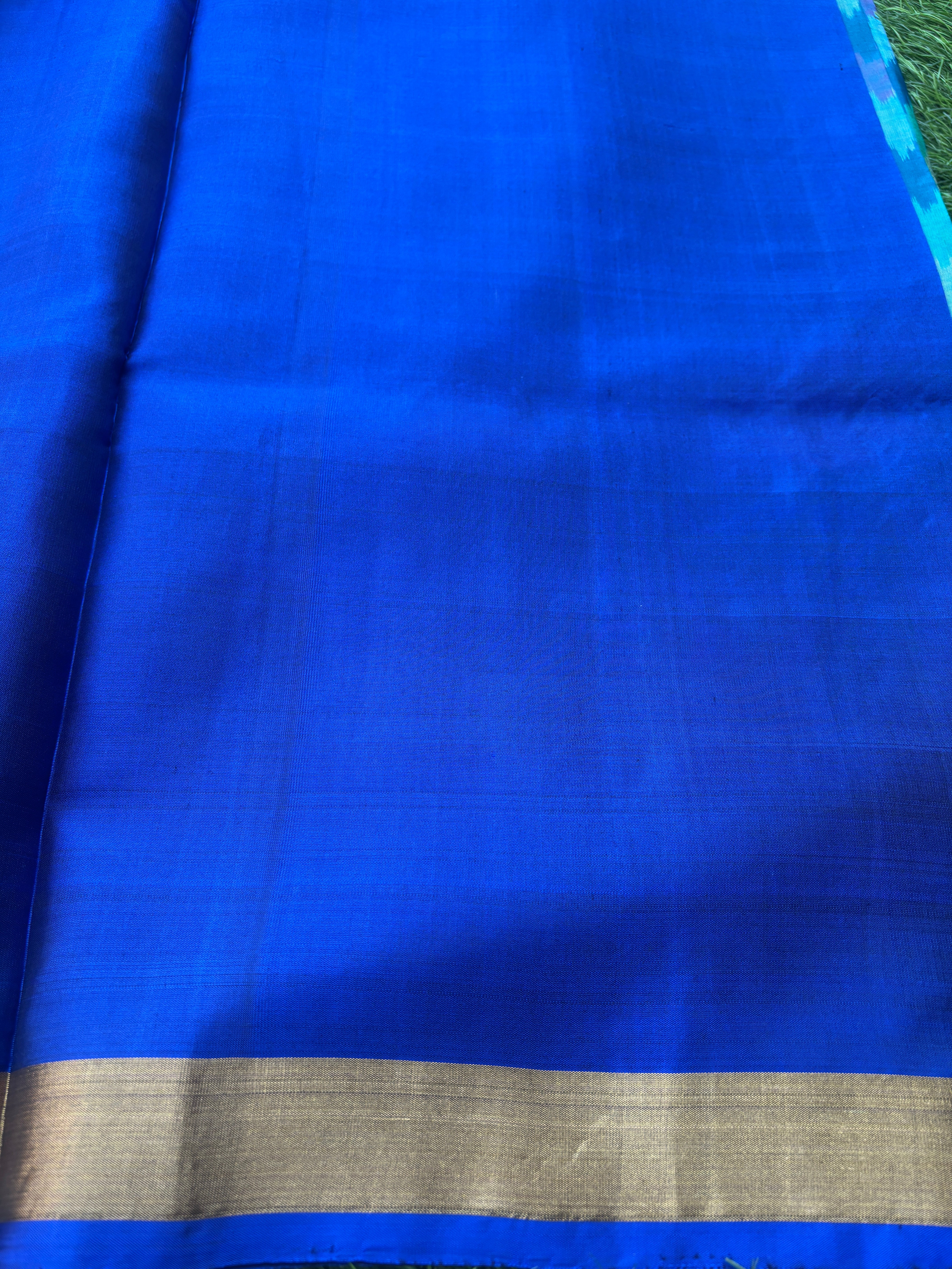 Pure Silk Ikkat Saree in Peacock Green & Peacock Blue in Multicolor Ikkat design and pallu and small golden Zari Border ikkat pallu with tassals