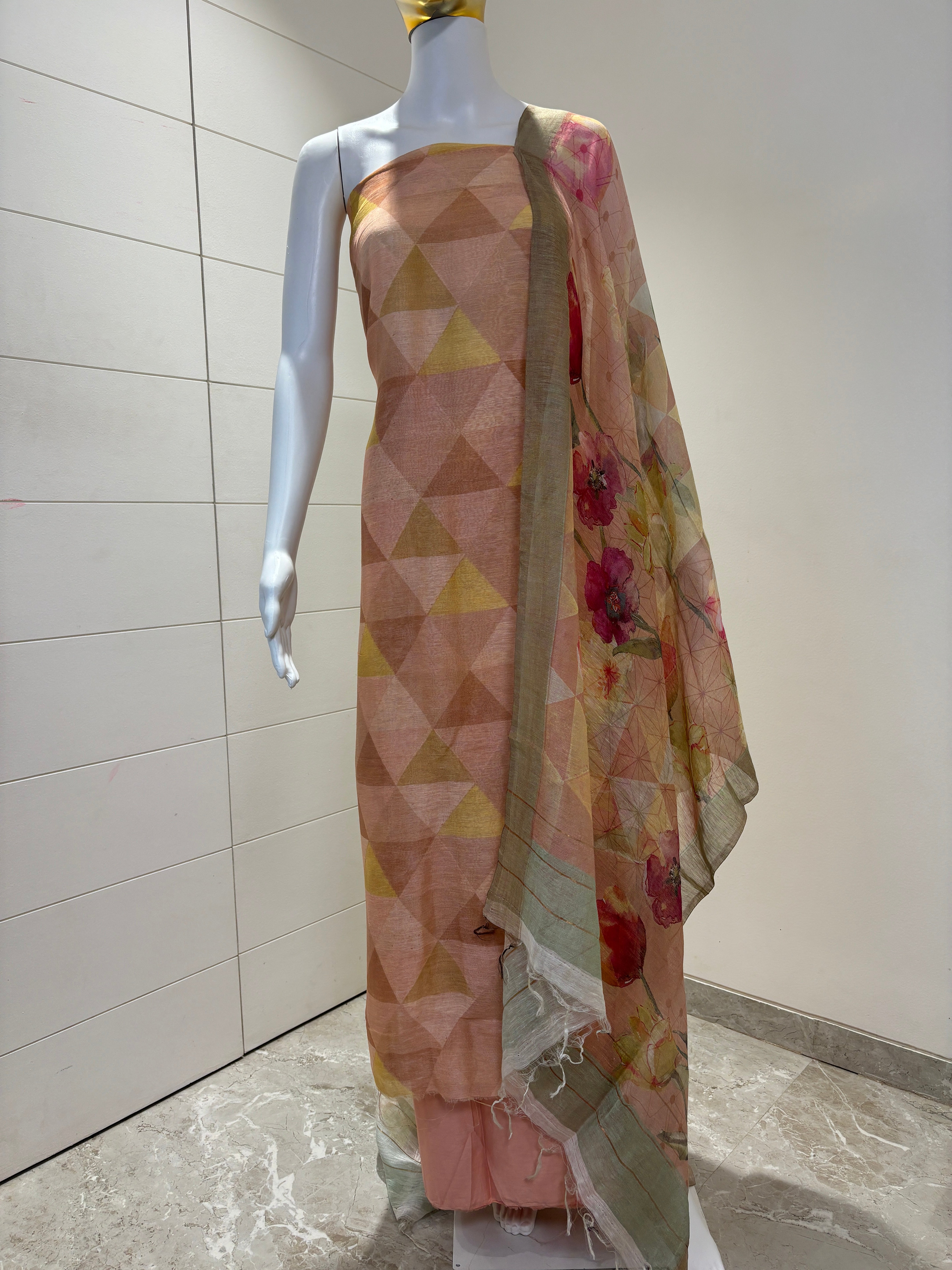 Peach pure linen silk suit material with geometric design and digital floral print dupatta by Chandrika Lifestyles
