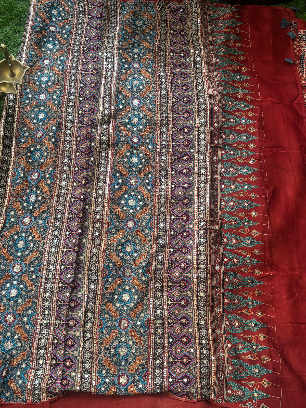 Royal Brick Red Pure Crepe Silk Saree with Ajrakh Print & Hand Mirror Work Pallu