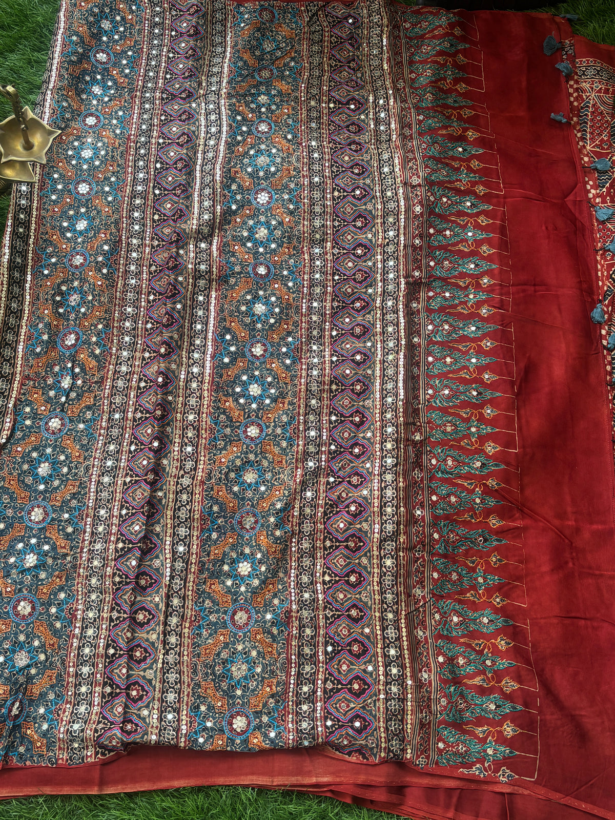 Royal Brick Red Pure Crepe Silk Saree with Ajrakh Print & Hand Mirror Work Pallu