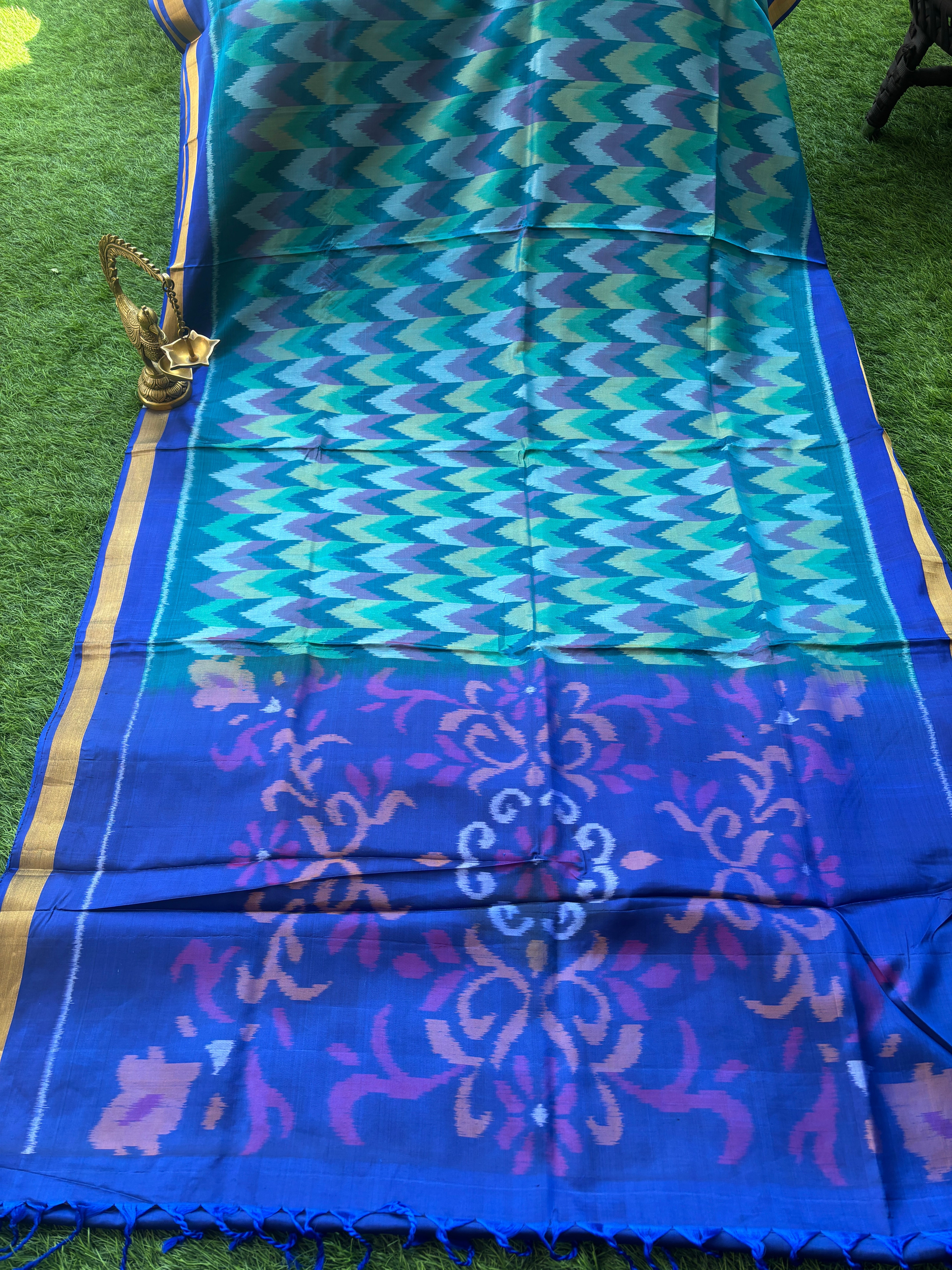 Pure Silk Ikkat Saree in Peacock Green & Peacock Blue in Multicolor Ikkat design and pallu and small golden Zari Border ikkat pallu with tassals